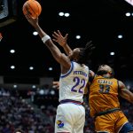 Peterson scores 28 points as Kansas hangs on to beat March Madness newcomer Cal Baptist 68-60